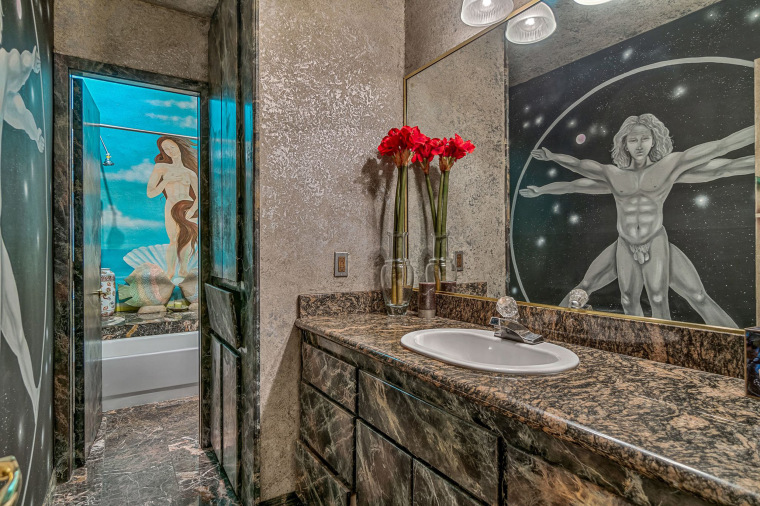 Replicas of Leonardo da Vinci's "Vitruvian Man" and Sandro Botticelli's "Birth of Venus" decorate one bathroom. 