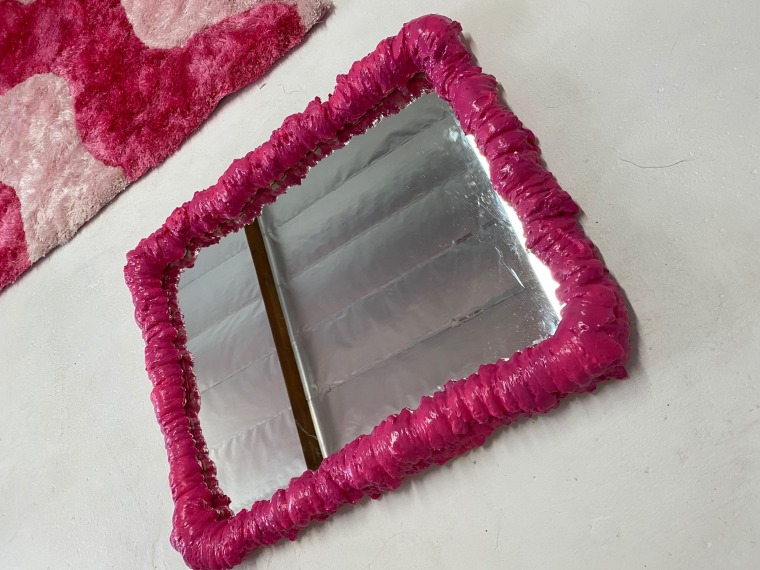 Beaubien, an interior designer, created a small pink foam mirror for a client.