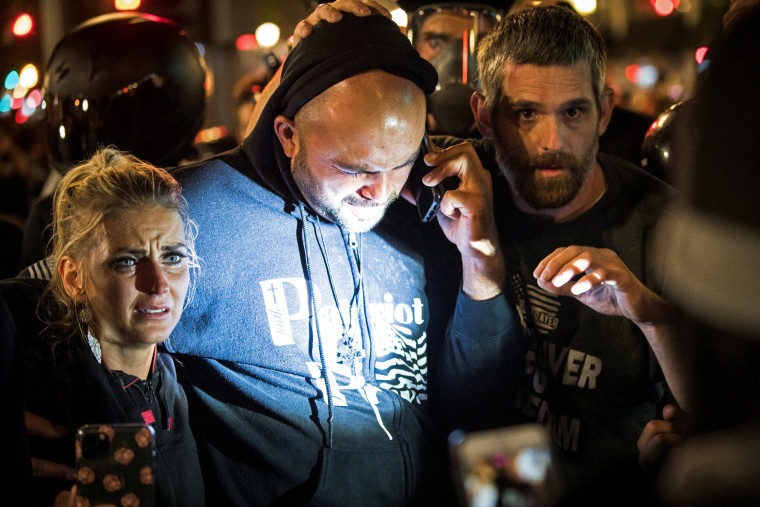 Image: Joey Gibson, leader of the right wing Patriot Prayer group, arrives at the scene of a shooting in Portland