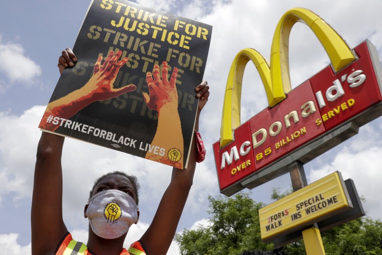 Image: Strike for justice protesters rally outside a McDonald's