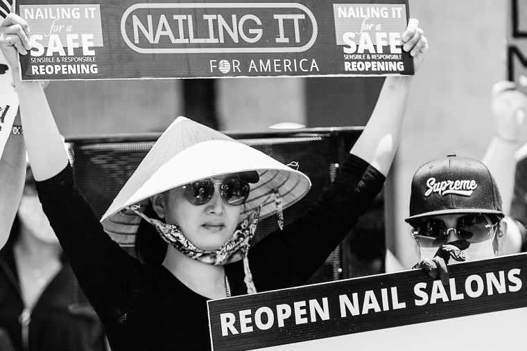 Vietnamese manicurists gather in Westminster, Calif. to call on the state to allow nail salons to reopen on June 8, 2020.