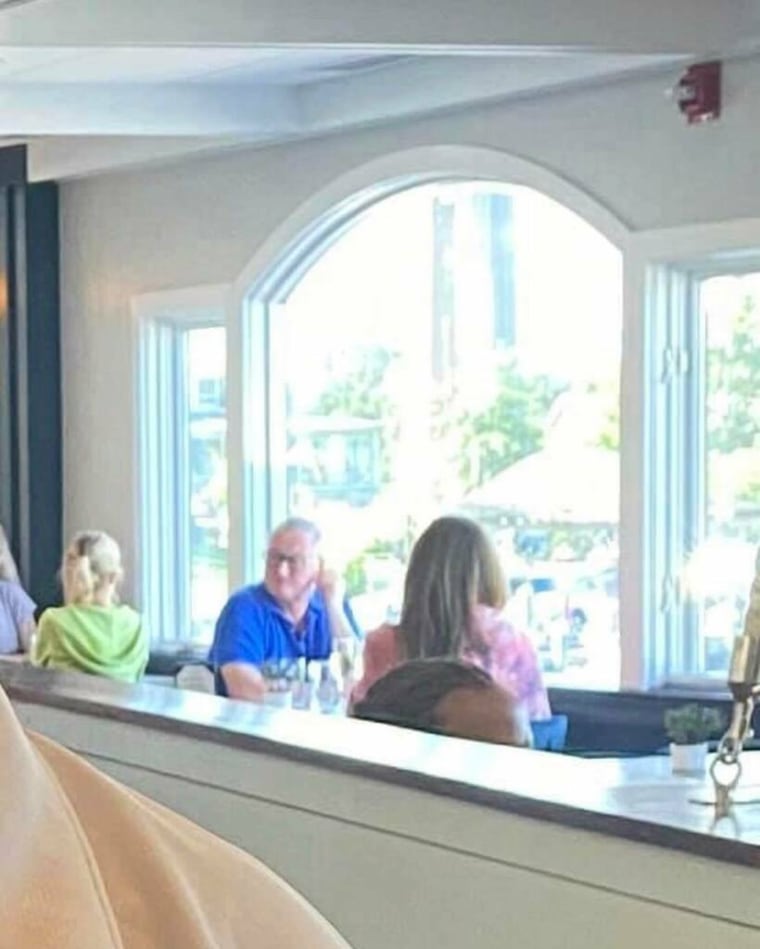 Philadelphia Mayor Jim Kenney, in blue, eats at a restaurant in Maryland on Aug. 30, 2020.