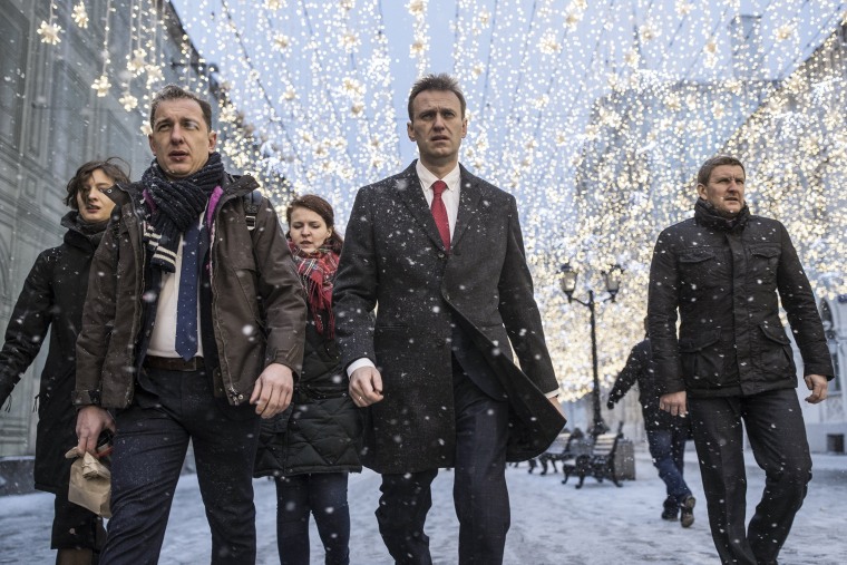 Image: Russian opposition leader Alexei Navalny heads to attend a meeting in the Russia's Central Election commission in Moscow