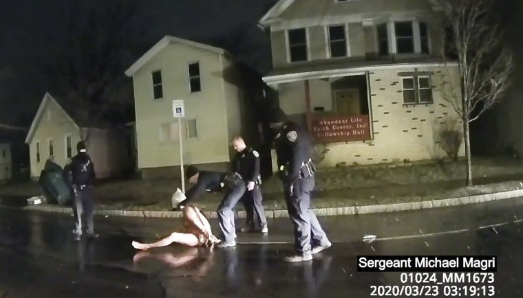 A Rochester police officer puts a hood over the head of Daniel Prude, on March 23, 2020, in Rochester, N.Y.