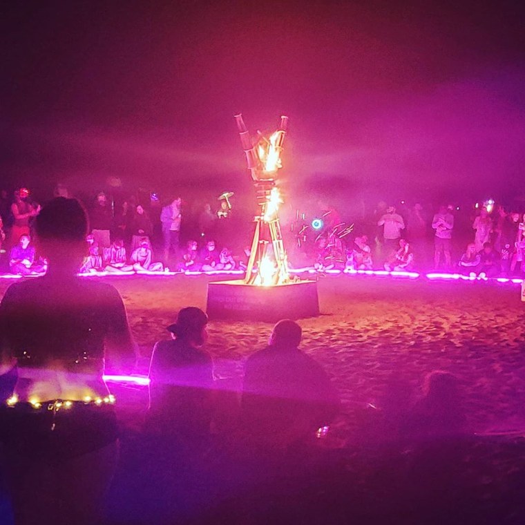 Crowds gather at Ocean Beach in San Francisco on Saturday night to celebrate what would have been the Burning Man festival in the Nevada desert but was canceled because of the coronavirus pandemic.