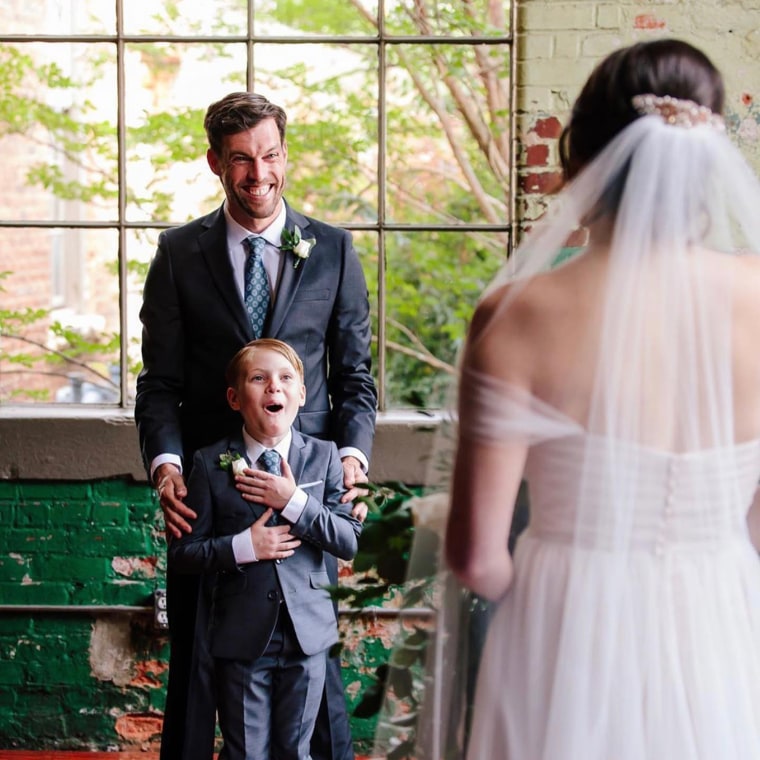 Jude, age 9, with his dad, Tyler Seabolt, and stepmom, Rebekah Seabolt, on their wedding day.