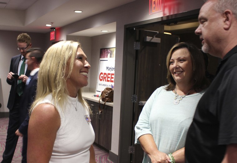 Image: House District 14 candidate Marjorie Taylor Greene talks with attendees at her watch party on at the Courtyard by Mariott in Rome, Ga