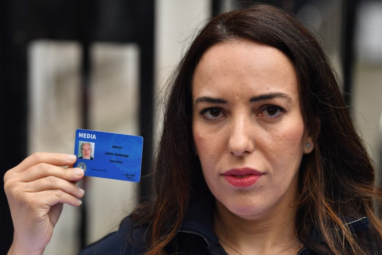 Image: Stella Moris, partner of WikiLeaks founder Julian Assange, poses holding a media card of Julian Assange as she attempts to deliver a petition and a Reporters Without Borders letter on press freedom to Downing Street in central London