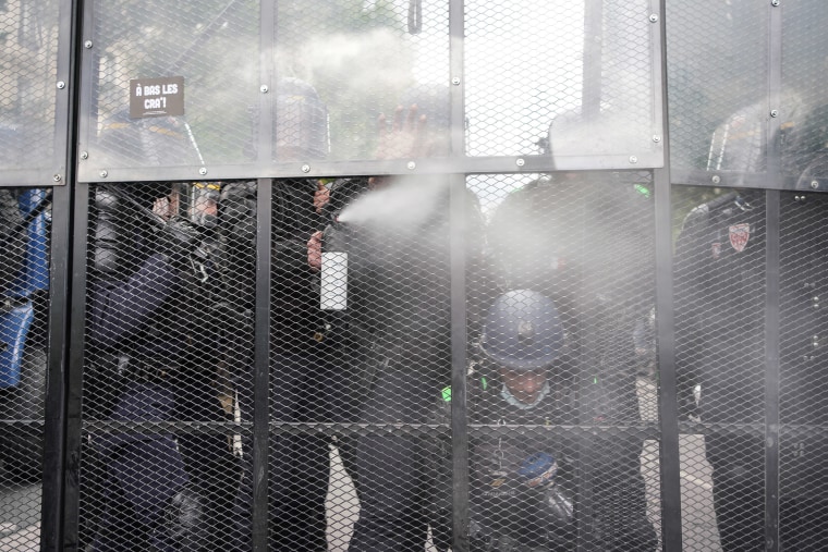 Image: Paris riot police fire tear gas to disperse a largely peaceful but unauthorized protest supporting the movement Black Lives Matter protest against brutality and racism near Place de la Republique.