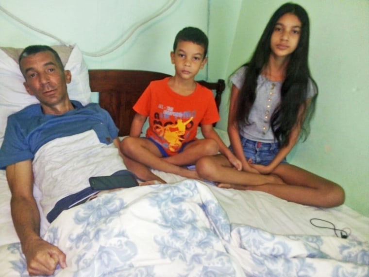 Ramon Arbolaez and his two youngest children, ages 12 and 6, in Reynosa, Mexico, in August 2020.