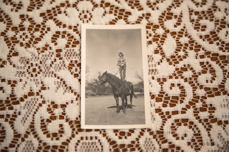 Image: Danielle Stephens riding a horse on the family ranch in Kingman