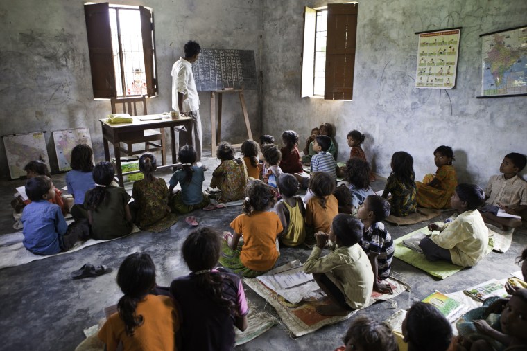 Image: Children from a Dalit community take part in education classes in the Maharjganj district in India.