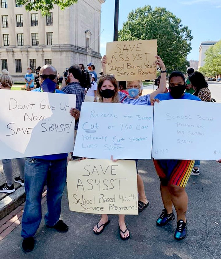 Demonstrators rally with the Trenton Student Voice Power Movement outside the State House in Trenton, N.J., to support saving school-based youth service programs on Sept. 4, 2020.