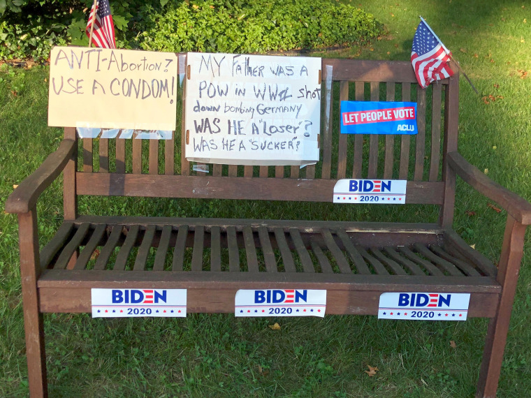 Janice Wolk, 74, transformed this bench turned into a pro-Biden and anti-Trump campaign sign at her home in suburban Pittsburgh.