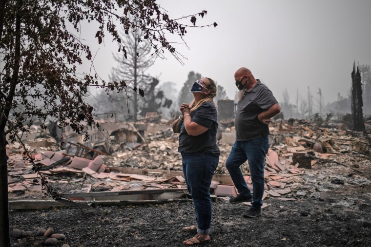 Image: Couple arrive to find their home gutted by the Almeda fire in Talent, Oregon