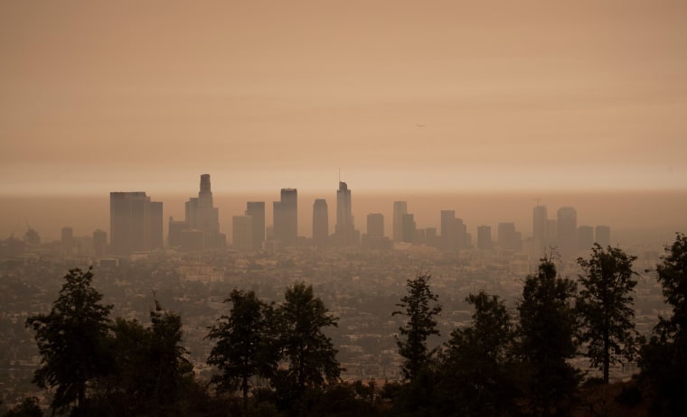 Image: The downtown skyline is pictured amidst the smoke from the Bobcat fire in Los Angeles