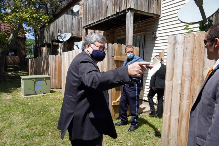 Attorney General William Barr and Kansas City Police Chief Richard Smith visit the apartment where 4-year-old LeGend Taliferro was killed, on Aug. 19, 2020.