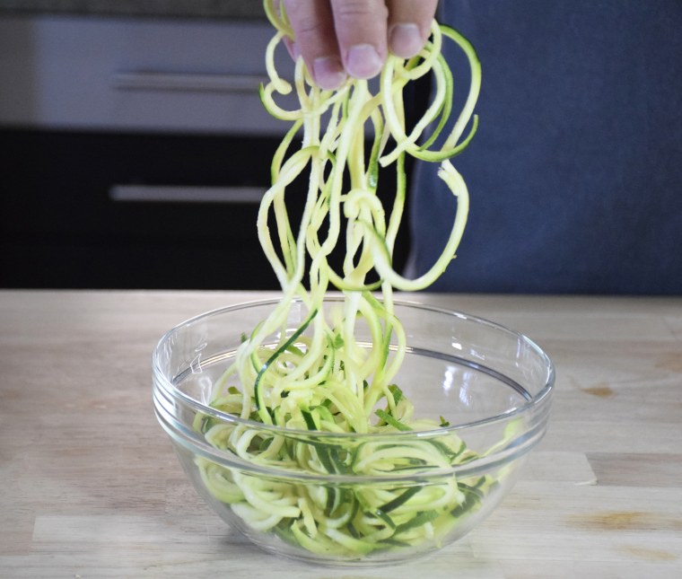 Use scissors to cut your long, spiralized zoodles into easier-to-eat pieces.