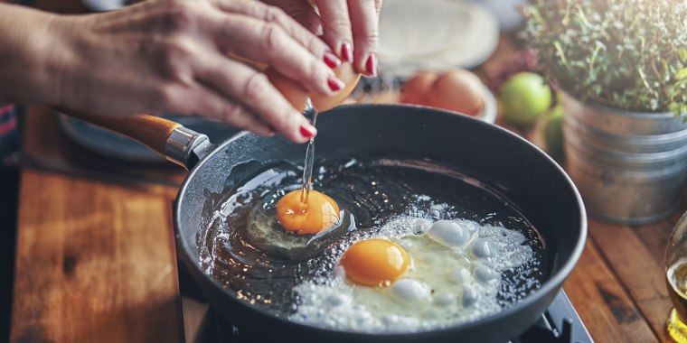 Frying Egg in a Cooking Pan in Domestic Kitchen