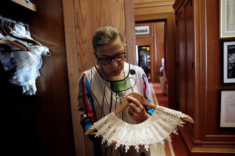 U.S. Supreme Court Justice Ginsburg shows robes in her chambers at the Supreme Court building in Washington