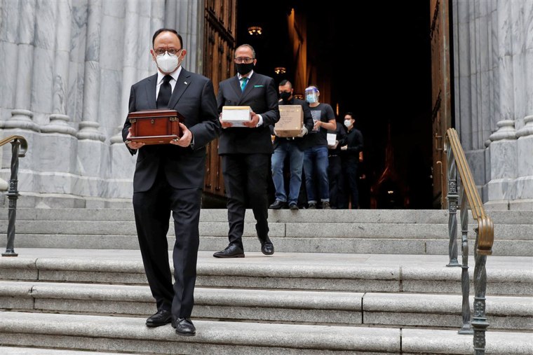 Mexican Consul General Jorge Islas Lopez leads people carrying cremated remains after a prayer service at Saint Patrick's Cathedral in New York on July 11. The service was held to bless the ashes of Mexicans who died during the coronavirus pandemic but could not have funeral Masses or burials.