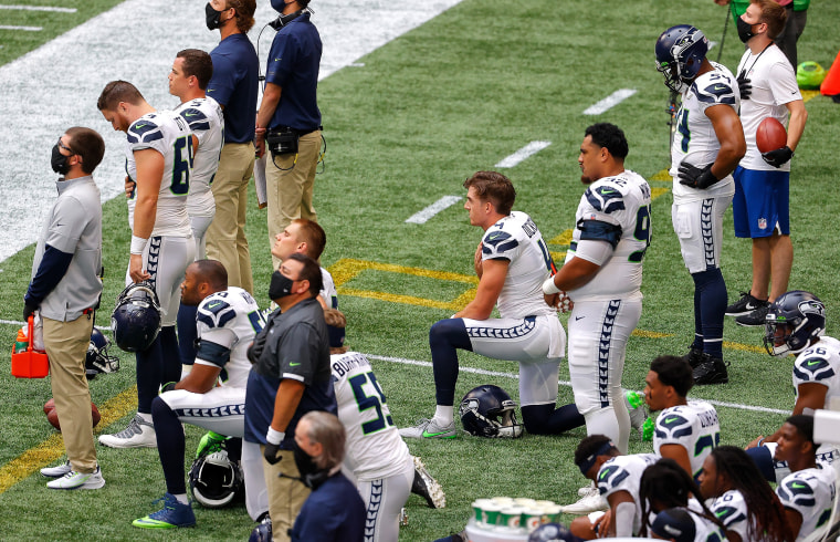 Falcons stand during both anthems; Seahawks protest