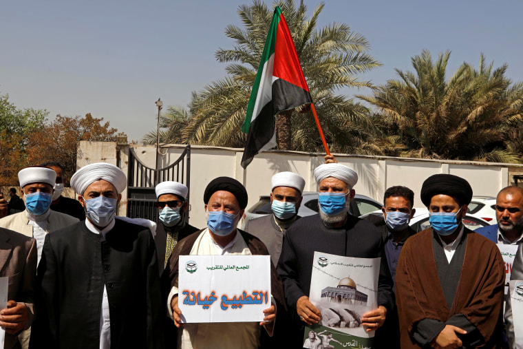 Image: Demonstrators protest against normalizing ties with Israel, in Baghdad