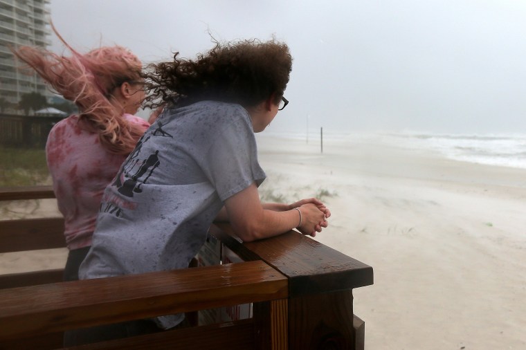 Image: Jordan Spence and Dawson Stallworth watch waves come ashore as Hurricane Sally approaches in Orange Beach