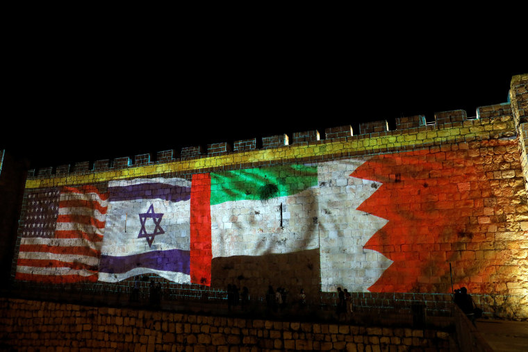 Image: National flags of Bahrain, UAE, Israel and the U.S. are projected on the walls of Jerusalem's Old City