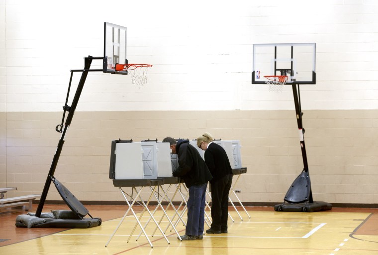 Image: A couple votes in Warren, Mich.