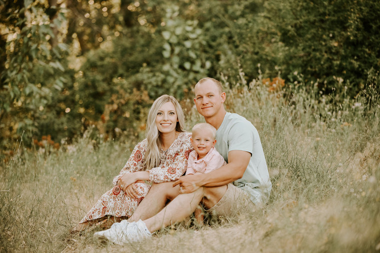 Emily Chrislip poses with her husband, Brandon, and their son, Camden. 