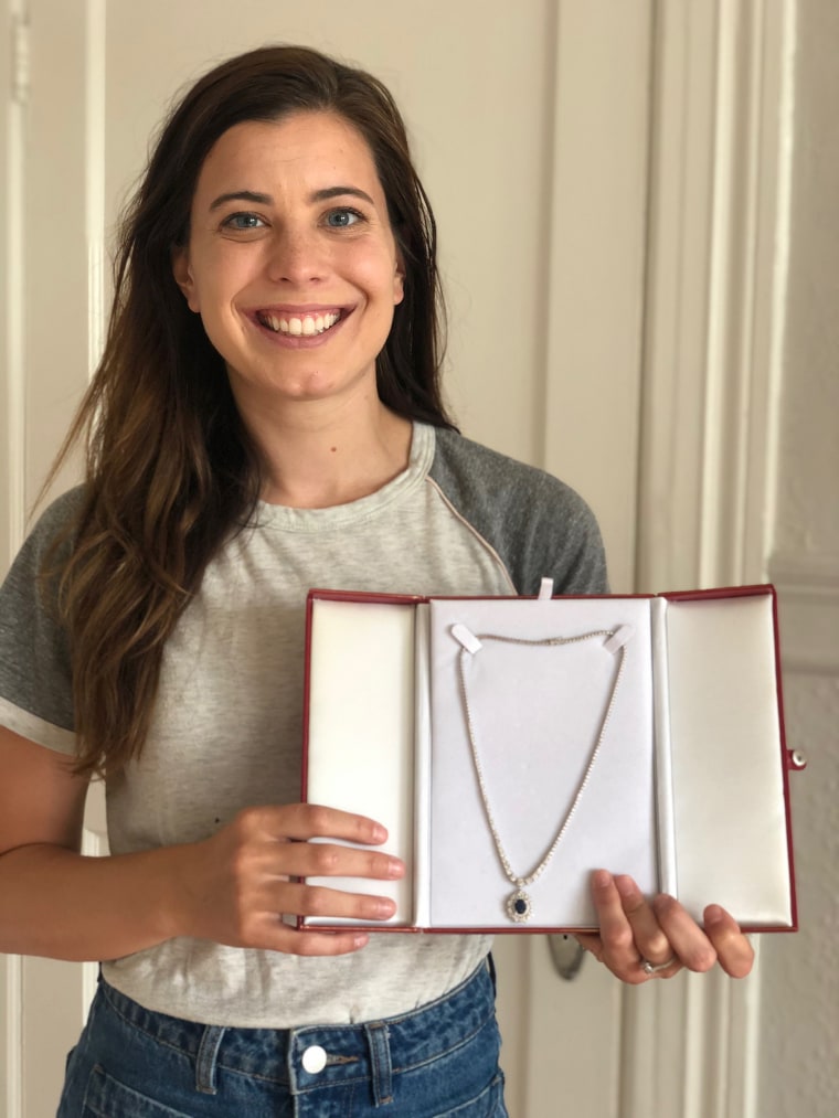 Demi Skipper, 29, holds up a recent trade. In exchange for a 2006 Mini Cooper convertible, Skipper received a diamond-and-sapphire necklace valued at $19,500. Unfortunately, 10 different jewelers inspected the necklace and valued it at only $2,500. Skipper was able to trade it for a Peloton exercise bike and is now trying to get the attention of Paris Hilton. This would mark her first celebrity trade. 
