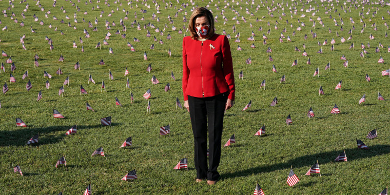 Image: American flags representing 200,000 lives lost due to coronavirus are placed on National Mall in Washington