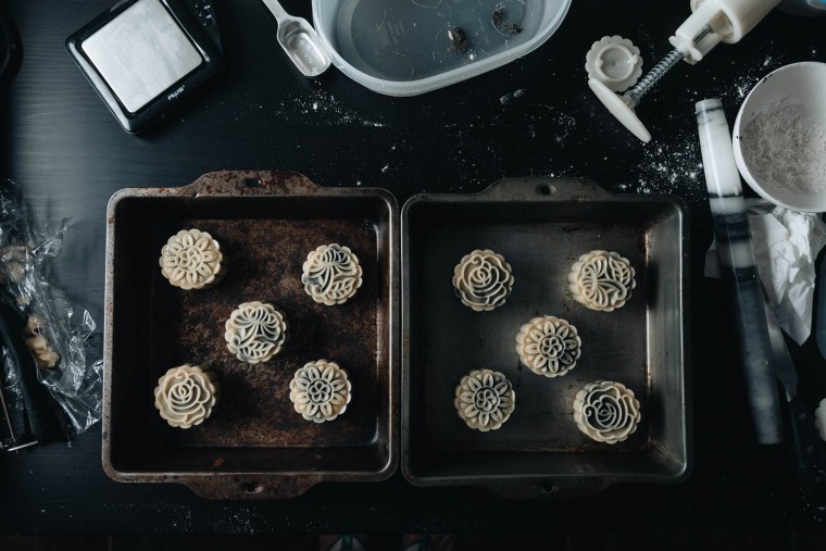 Mooncakes can be made in multiple batches with different fillings and pressed with different patterns.