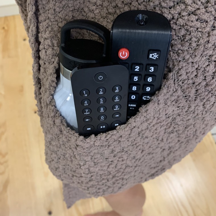 the sweater pocket can fit two remotes, my water bottle and more