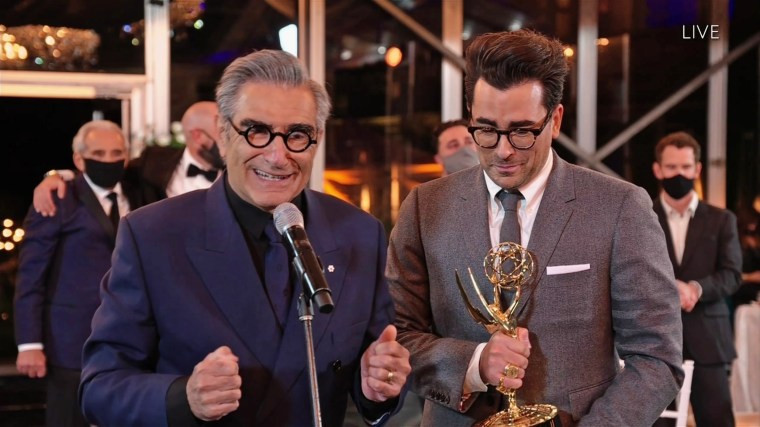 Eugene Levy, left, and Daniel Levy from "Schitt's Creek" accept the Emmy for Outstanding Comedy Serie. 