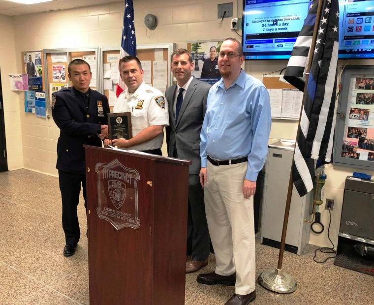 New York Police Department officer Baimadijie Angwang, left, in 2018.