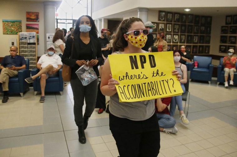 Protesters arrive at a Norman City Council meeting on June 9, 2020, to present a list of demands to the council which included defunding the police.