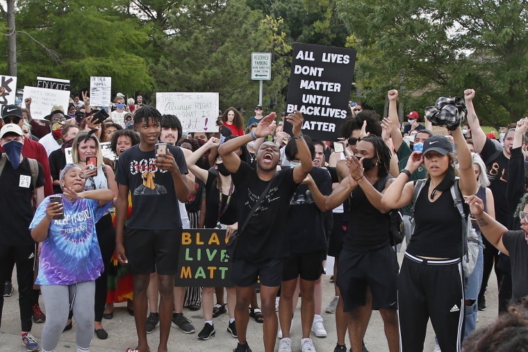 Black Lives Matter demonstrators chant outside the Norman Police Department on June 2.
