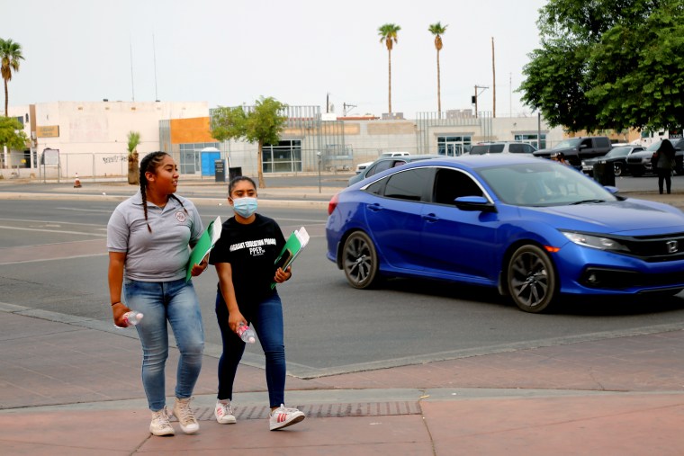 Jimena and Leslie Aguilar, 15, make their way across the Arizona/Mexico border to visit their parents in San Luis Rio Colorado in Sonora, Mexico.