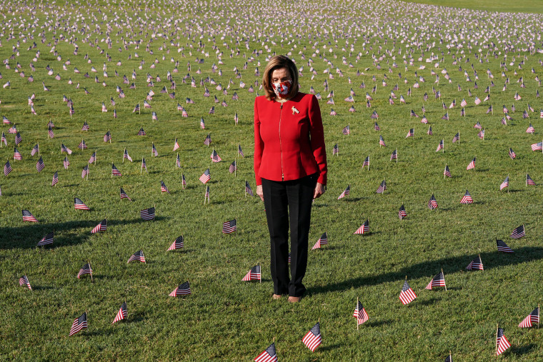 Image: American flags representing 200,000 lives lost due to coronavirus are placed on National Mall in Washington