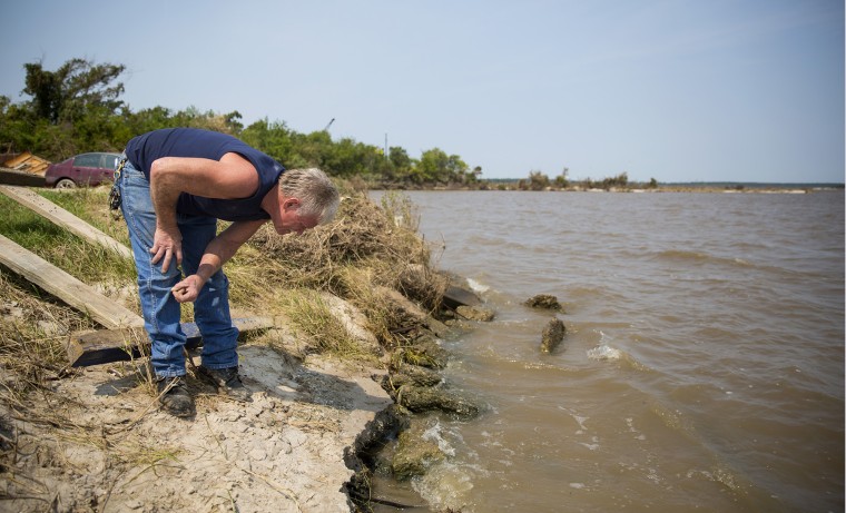 Bobby Griffin on his property along the San Jacinto River in Channelview, Texas, where he  found dangerous globules of mercury washed or blown ashore.