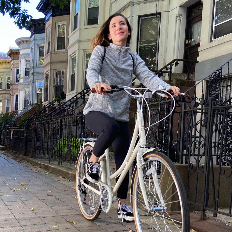 woman wearing gray amazon pullover sweatshirt outside