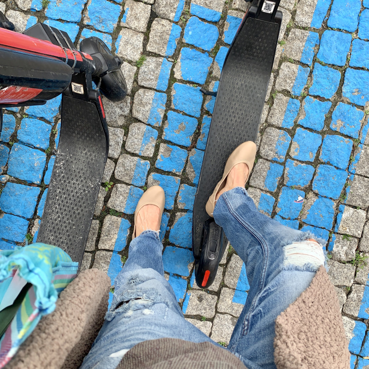 wearing my Amazon Essentials ballet flats while getting ready to scooter