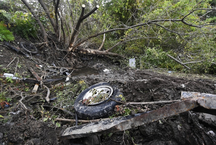 Debris is seen scattered Sunday, Oct. 7, 2018, at the site of yesterday's fatal crash Schoharie, New York.