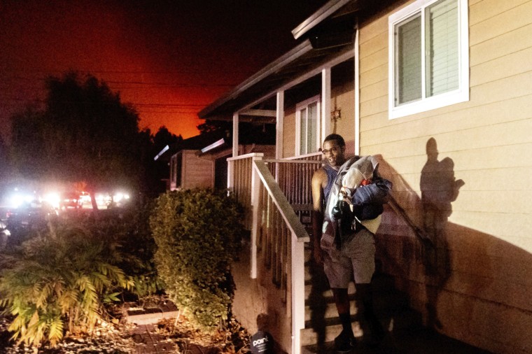 Image: Eddy Whitmore evacuates from his Santa Rosa, Calif., home as the Shady Fire approaches