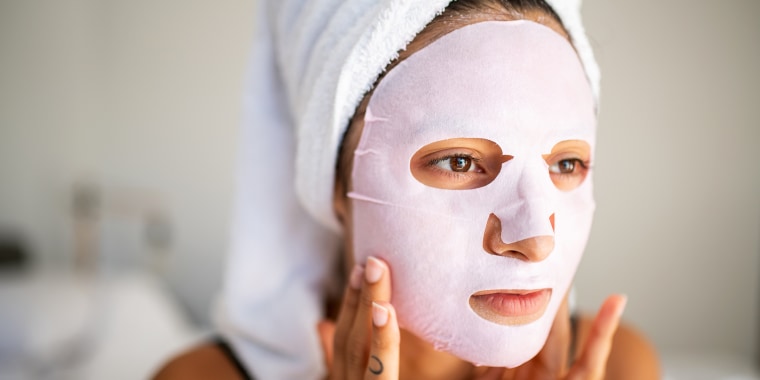 woman wearing sheet face mask
