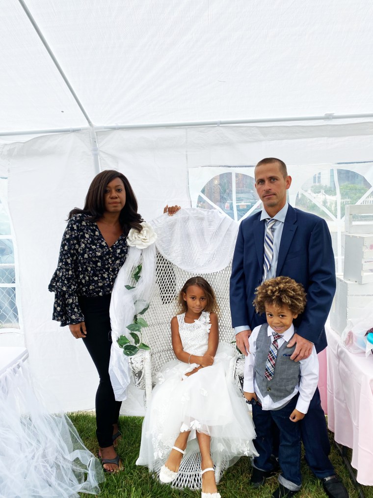 Lilith Costa and her husband, Tom, celebrate their daughter's communion with son Thomas in September 2020.