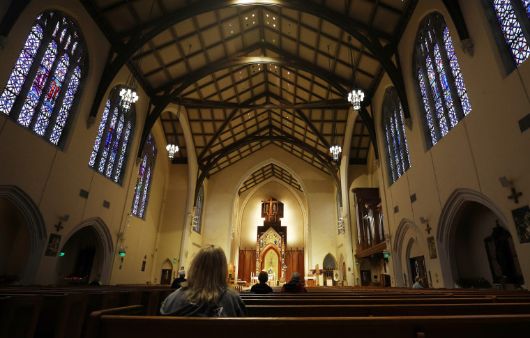 Image: Worshippers at the St. Agnes Cathedral in Rockville Centre
