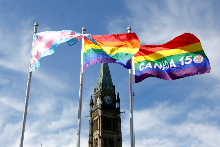 Image: FILE PHOTO: The transgender pride, pride and Canada 150 pride flags fly on Parliament Hill in Ottawa
